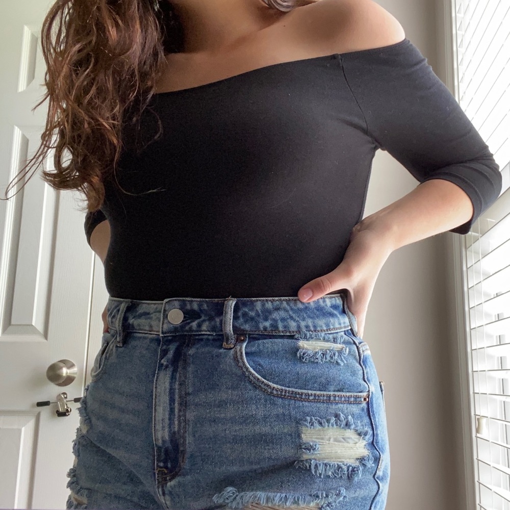 Black off the shoulder body suit.  Mid arm sleeve.